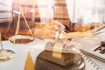 Business and lawyers discussing contract papers with brass scale on desk in office. Law, legal services, advice, justice and law concept picture with film grain effect