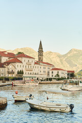 Historic city of Perast in the Bay of Kotor in summer at sunset