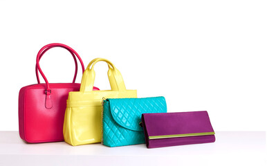 Colourful bags isolated on white background. Copy space. Leather products.	
