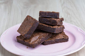 brownie pieces on a pink plate