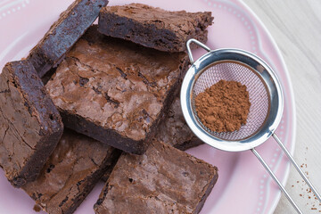 brownie pieces on a pink plate