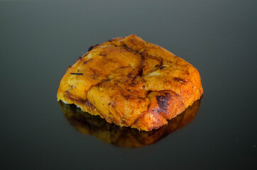 Sliced ​​bread with paprika, piece, photo on a dark surface