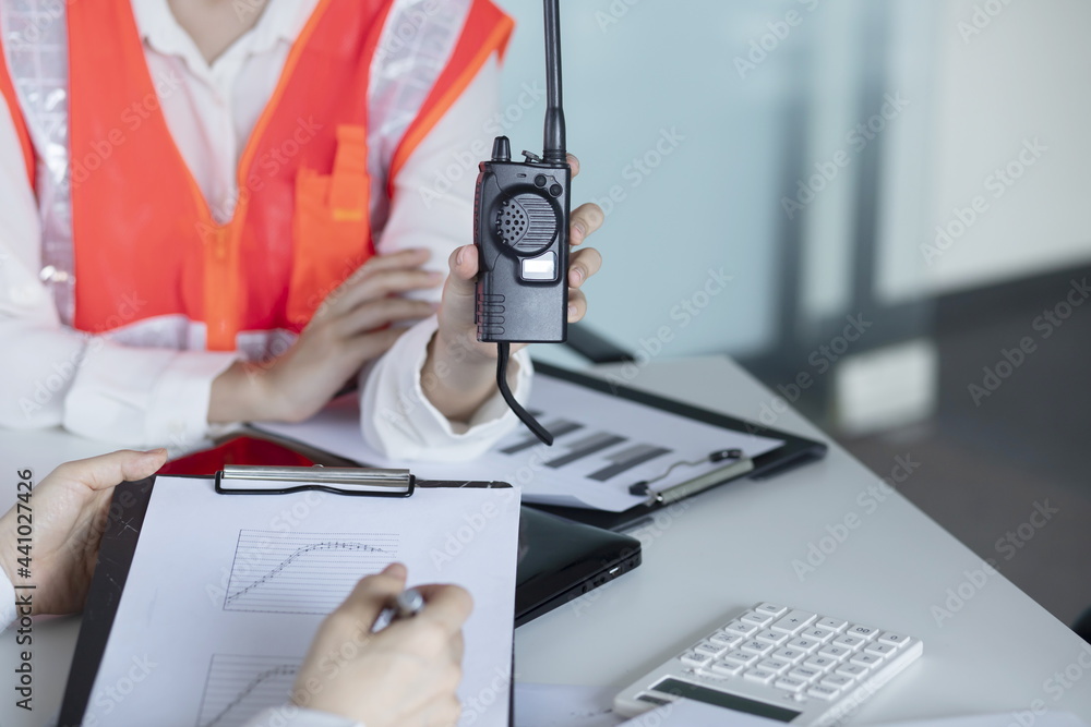 Wall mural engineers meeting with walkie talkie