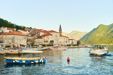 Historic city of Perast in the Bay of Kotor in summer at sunset