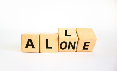 All or alone and support symbol. Turned the wooden cube and changed the word alone to all. Beautiful white background. Business and all or alone and support concept. Copy space.