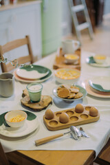 Details of a modern kitchen in a Scandinavian rustic style in light green shades.