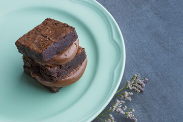 hazelnut cream brownie sandwich on a green plate