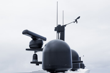 The mast of a large yacht with navigation equipment. Radar, signal lights, satellite dishes and...