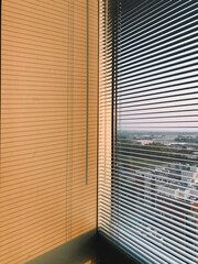 fine shadows of blinds on a white wall in a skyscraper