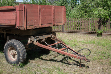 View of a part of the old tractor trailer. Summer rest day in the village. Hitching a cargo...