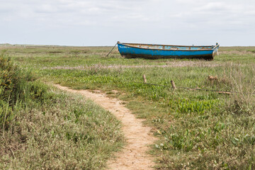 Boat stranded at Brancaster Staithe