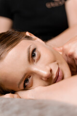 4 hands massage in spa. Two masseurs are making four hands relaxing massage with oil for girl. Relaxation. Manual therapy