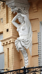 Building facade decoration with sculptures of people