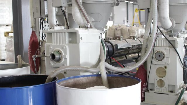 Barrel with polypropylene granules in the technological process. PP Pet Chips Semi Dull, PET chips recycle, PET polyester chips