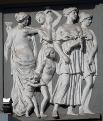 Building facade decoration with sculptures of people