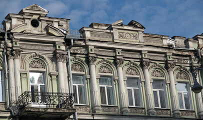 Facade of an old building with a balcony