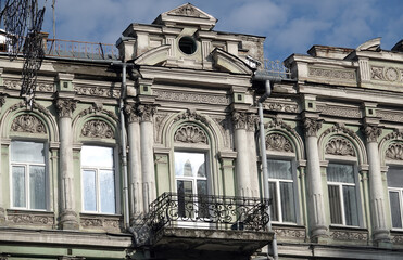 Facade of an old building with a balcony