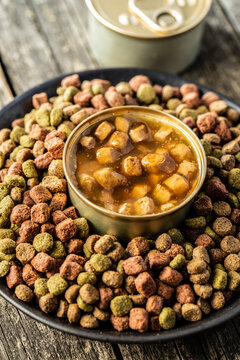 Canned pet food and dried kibble. Tasty food for dog or cat.