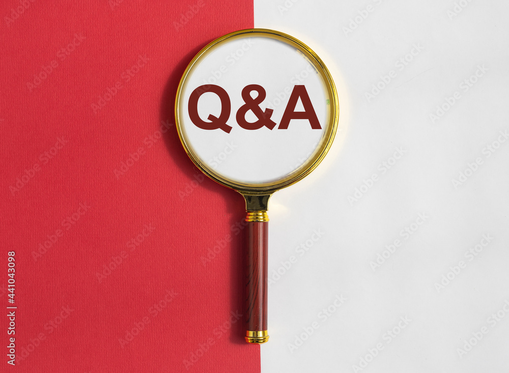 Poster qna inscription on red and white background through magnifying lens. qa acronym. q concept. question