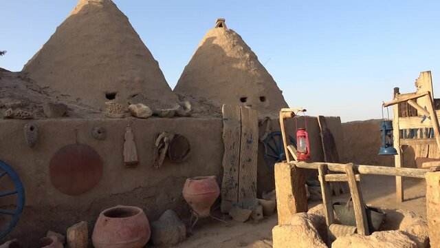 Harran, Sanliurfa, Turkey - 14th of June 2021: 4K Ancient household items in the courtyard of the Harran houses
