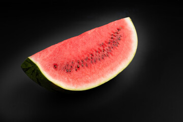 Fototapeta na wymiar slices of watermelon isolated on black background