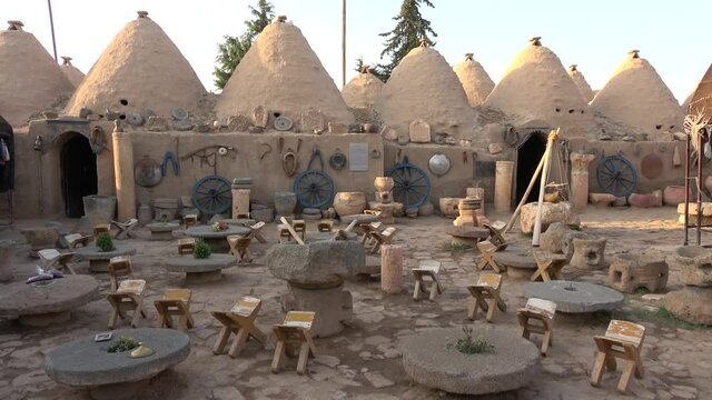 Harran, Sanliurfa, Turkey - 14th of June 2021: 4K Touristic cultural house made on the site of the ancient beehive houses

