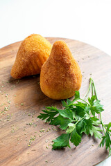 Coxinha, traditional snack of Brazilian cuisine stuffed with meat,  white background.