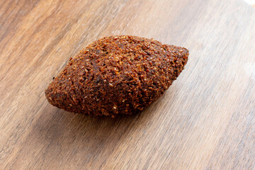 Kibbeh - Middle Eastern minced meat and bulghur wheat fried snack. Also popular party dish in Brazil (kibe).