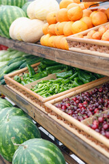 a counter with fruits and vegetables. Wooden counter in the market. Fruit shop