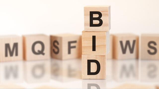 word bid from wooden blocks with letters, concept