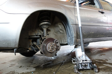 The structure and elements of suspension of a modern car. Shock absorber, suspension arm, spring, subframe. Concept repair and service of a modern car
