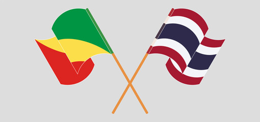 Crossed and waving flags of Republic of the Congo and Thailand