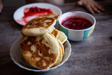 Breakfast with tortillas and strawberry jam