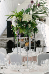 Decorative decoration of tables with natural and artificial flowers
