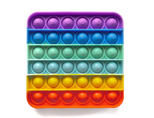 Rainbow antistress finger push toy for kids pop it isolated on white background