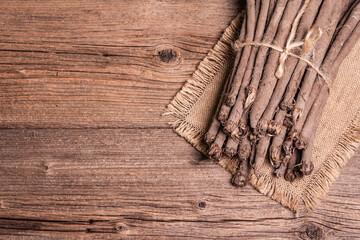 Bunch of raw Scorzonera or Spanish salsify on vintage wooden table