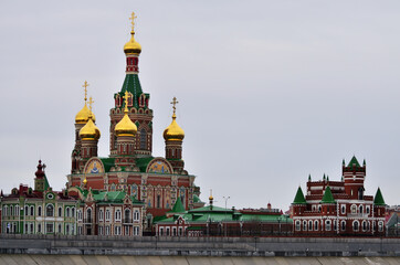 Fototapeta na wymiar Cathedral of the Epiphany in cloudy weather. Russia Yoshkar-Ola 01.05.2021. High quality photo