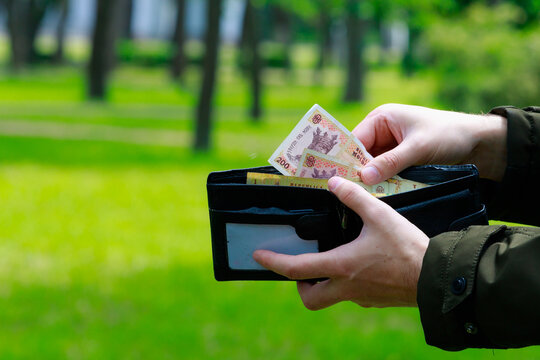 Moldovan lei MDL in mens hands. Economic background with copy space