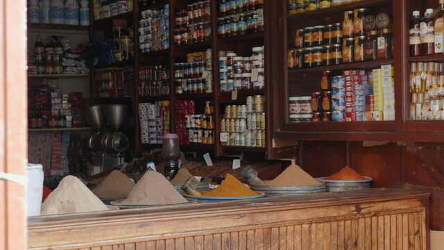 Selection of different arabian spices cosmetics on a traditional Moroccan market souk in Marrakech, Morocco. A lot of pepper, cardamon, cumin, curry