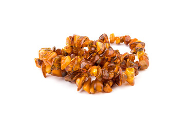 Baltic necklace made of Natural polished transparent honey luxury amber beads with inclusions on white. close up selective soft focus. Space for text