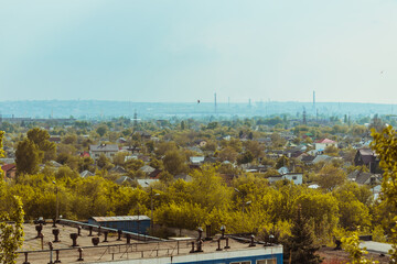 Obraz premium View of a quiet residential area, where the roofs of private houses are visible. 