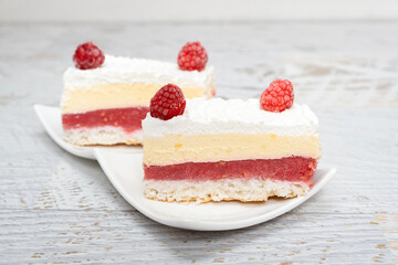 Piece of vanilla slice cake, and raspberries