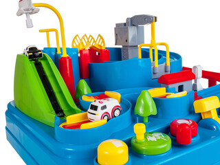 Fototapeta premium Children's toy town slide with obstacles, run police toy cars, ambulance, helicopter