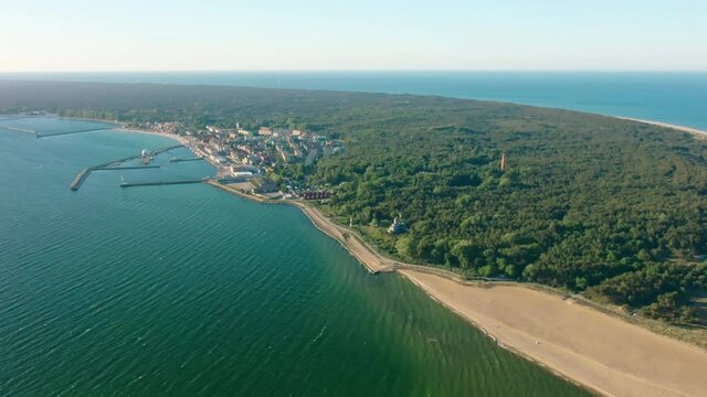 Aerial Landscape of Hel City, Port and Peninsula in Baltic Sea in Poland in Summer with Sand Beach and Forest. Travel and Vacation Destination in Europe. 4K Drone Pan Right Shot