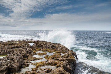 Ocean wave crushes on stone coastline of Inishmore, Aran Islands, County Galway, Ireland. Irish...