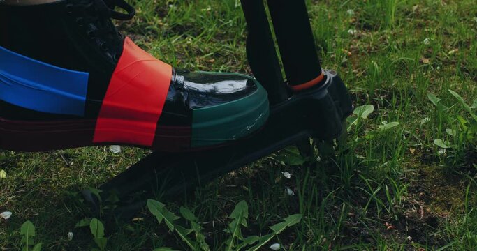 Gardening weeding. Gardener remove weeds dandelions.Tool for removing dandelion weeds by pulling tap root. Weed Control