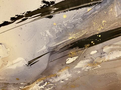 Abstract vanilla background with gold and grey — beautiful brush strokes, smears and gold spots. Fragment of modern painting with beige and grey texture resembles watercolor or aquarelle painting.