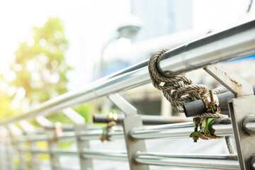 Selective focus to scaffolding pipe clamp and parts with rope. 
scaffolding clamps in used close up on construction site.
