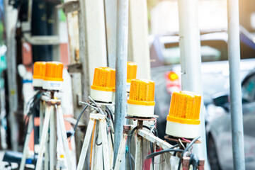 Many yellow orange siren light on the street. 