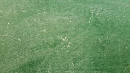 Green board background with white dust stains.